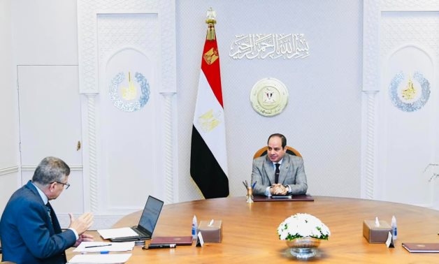 resident Abdel Fattah El-Sisi meets with the Suez Canal Authority Chief Osama Rabie - press photo