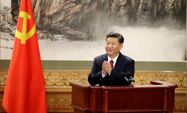 File- Chinese President Xi Jinping claps after his speech as China's new Politburo Standing Committee members meet with the press at the Great Hall of the People in Beijing, Oct. 25, 2017. REUTERS/Jason Lee