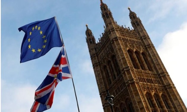 Protesters wave the EU and Union flags outside the Palace of Westminster, London, Britain, December 20, 2017. REUTERS/Peter Nicholls