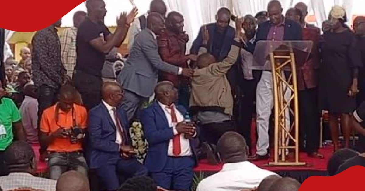 Nyamira man kneels