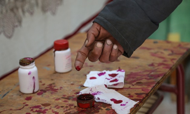 File- Man inked his finger after casting vote in 2019 referendum in constitutional amendment