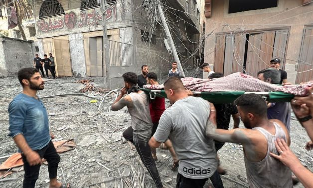 Palestinians in Gaza Strip carry body of one of martyrs killed by Israeli occupation bombing on the Strip- Photo via Palestinian Journalist from Gaza Hani El Shaer