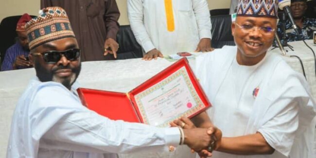 Nigerians react as Ododo kneels to present Certificate of Return to Yahaya Bello