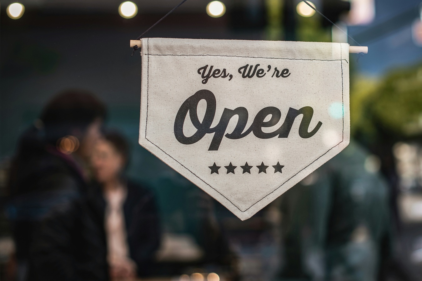 We are open sign in front of a business