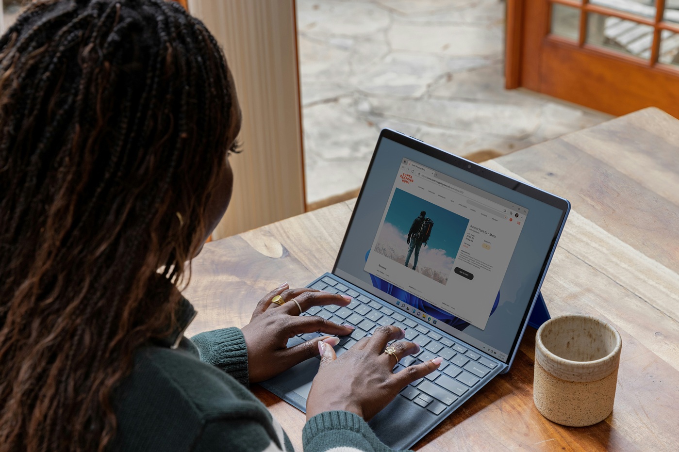 a lady working on the laptop