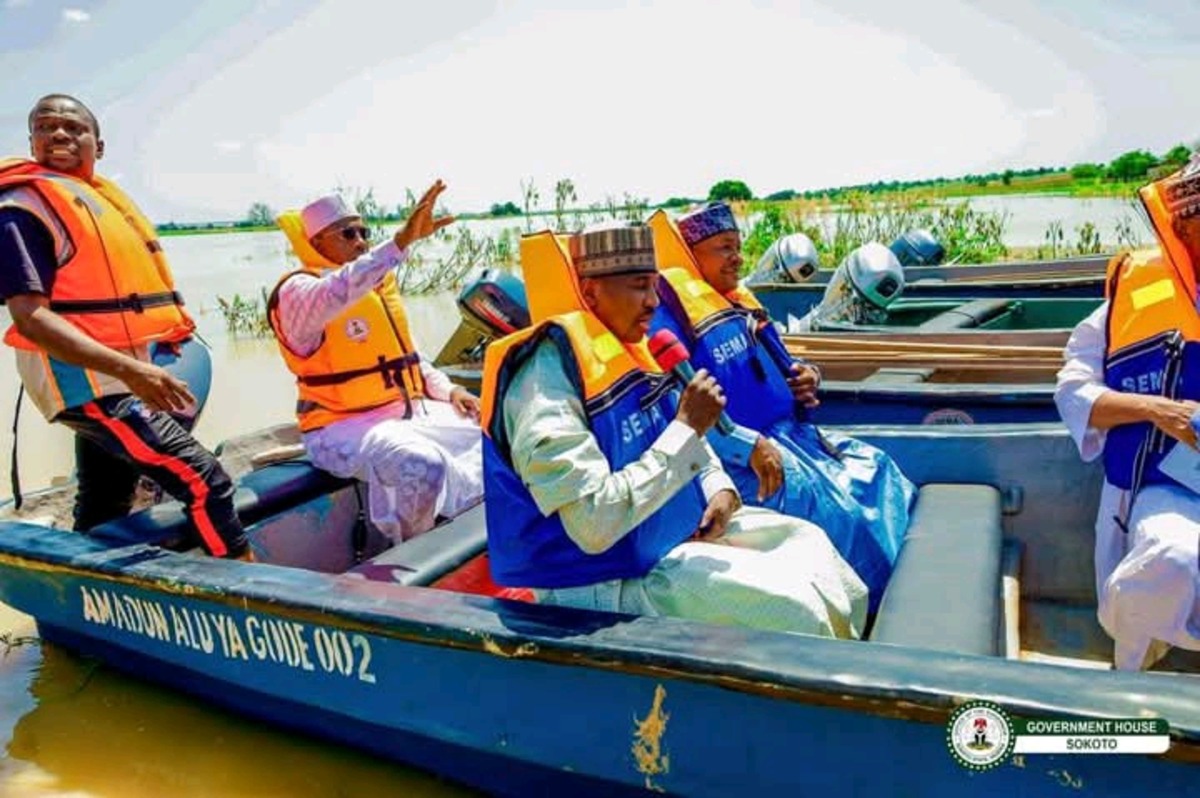 Governor Ahmed Aliyu wearing life jacket on a boat