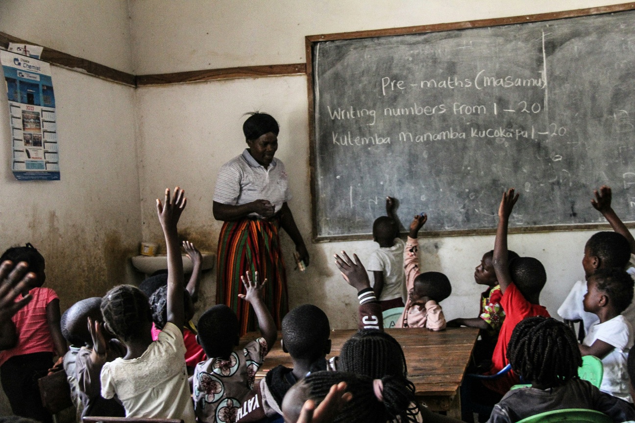 Teacher and pupils in classroom
