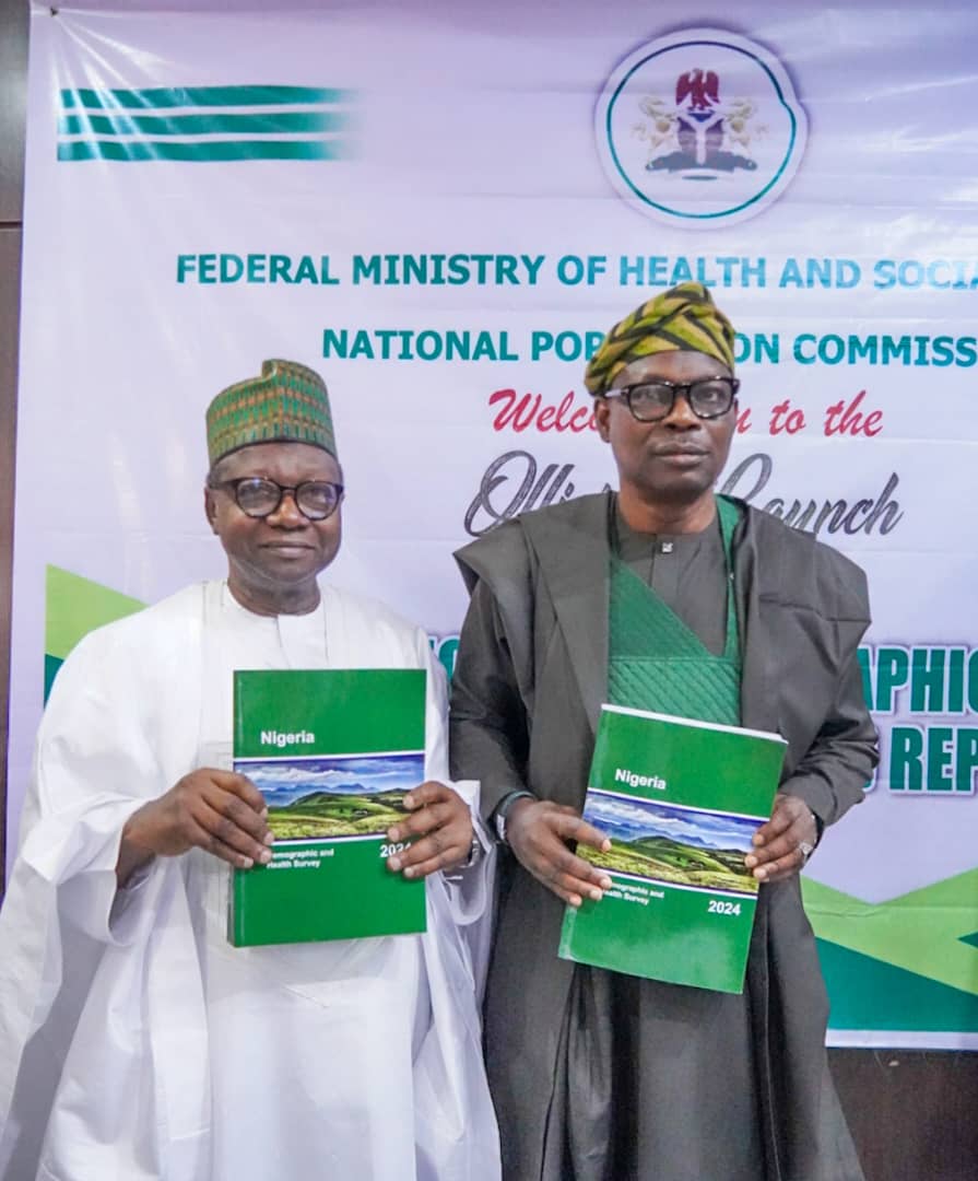 Minister of State for Health and Social Welfare, Dr. Iziaq Adekunle Salako, holding 2024 NDHS report