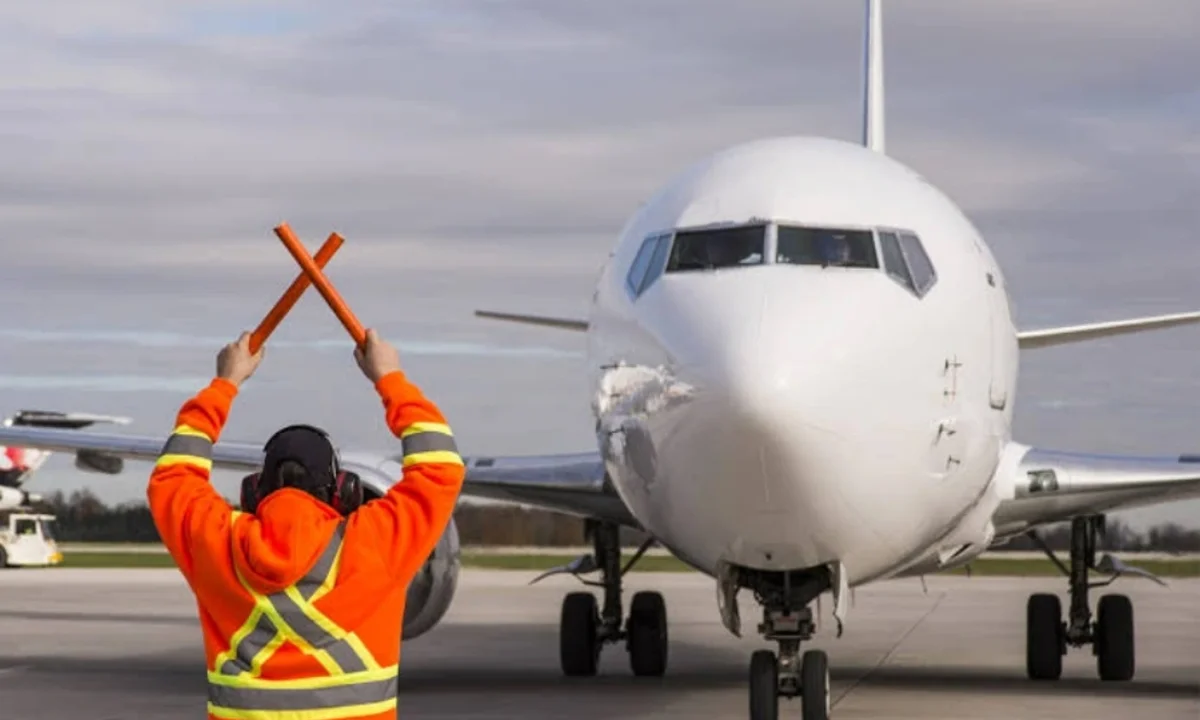 Aviation worker in front of an airplane
