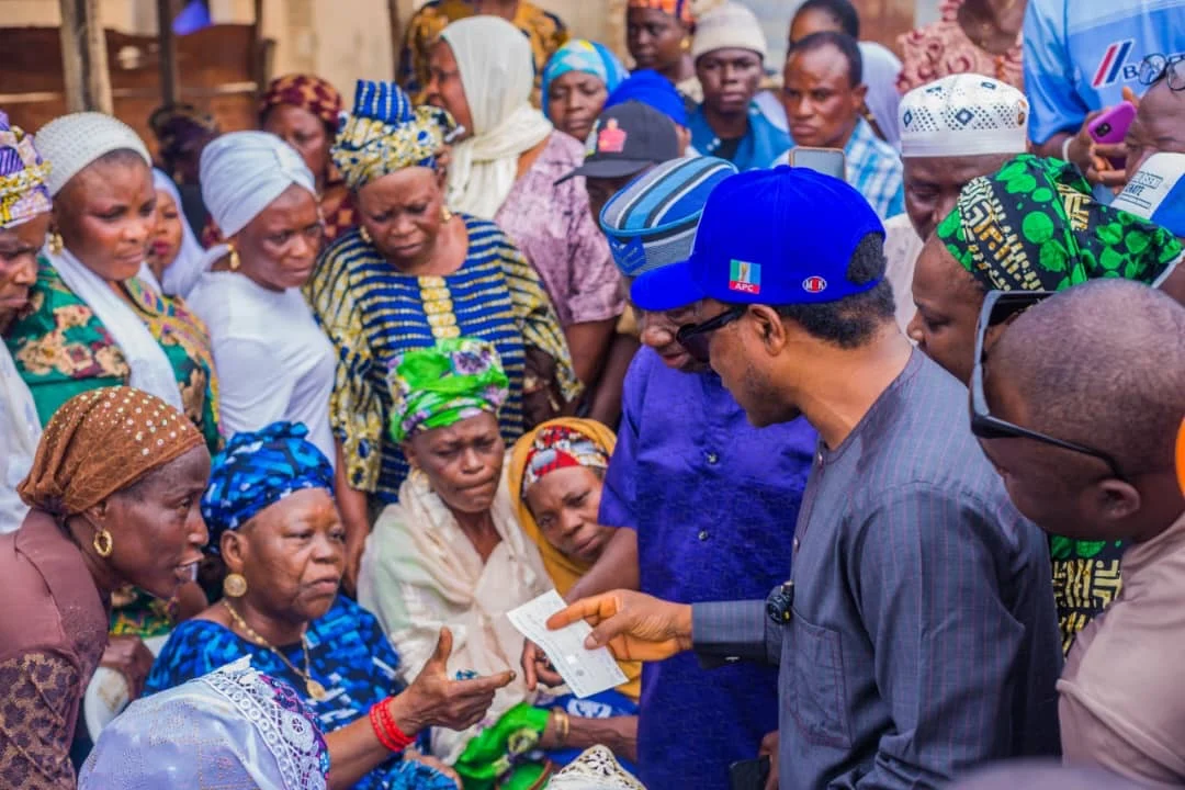 Remi Oseni at Bode Market with victims of fire incident
